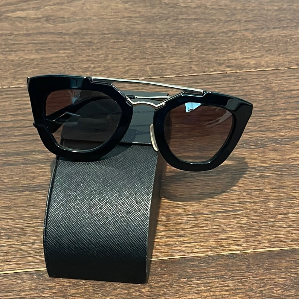 Prada Women’s Black and Gold Sunglasses