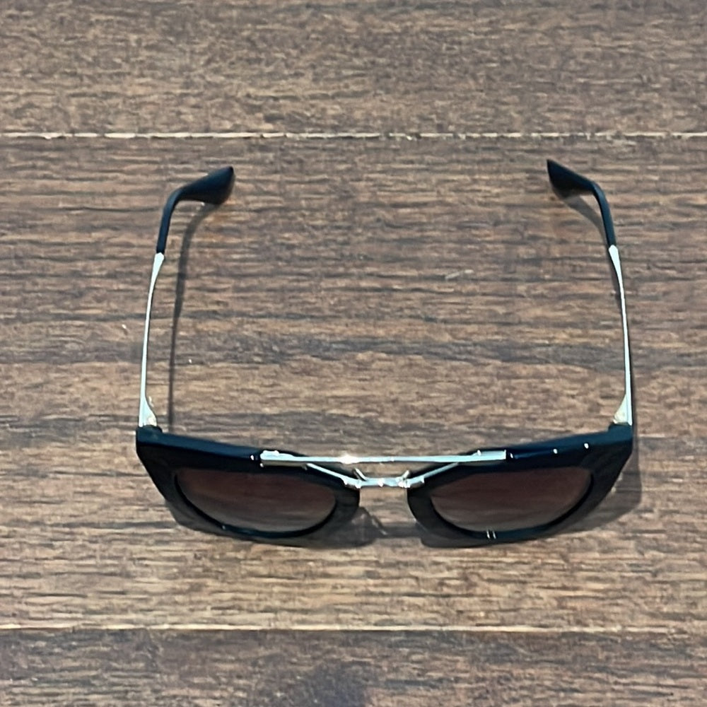 Prada Women’s Black and Gold Sunglasses