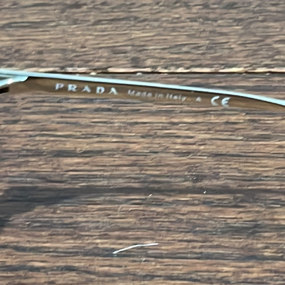 Prada Women’s Black and Gold Sunglasses