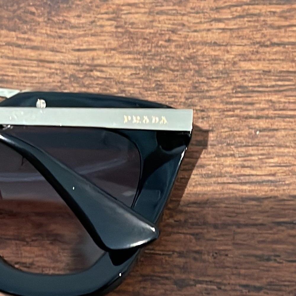 Prada Women’s Black and Gold Sunglasses