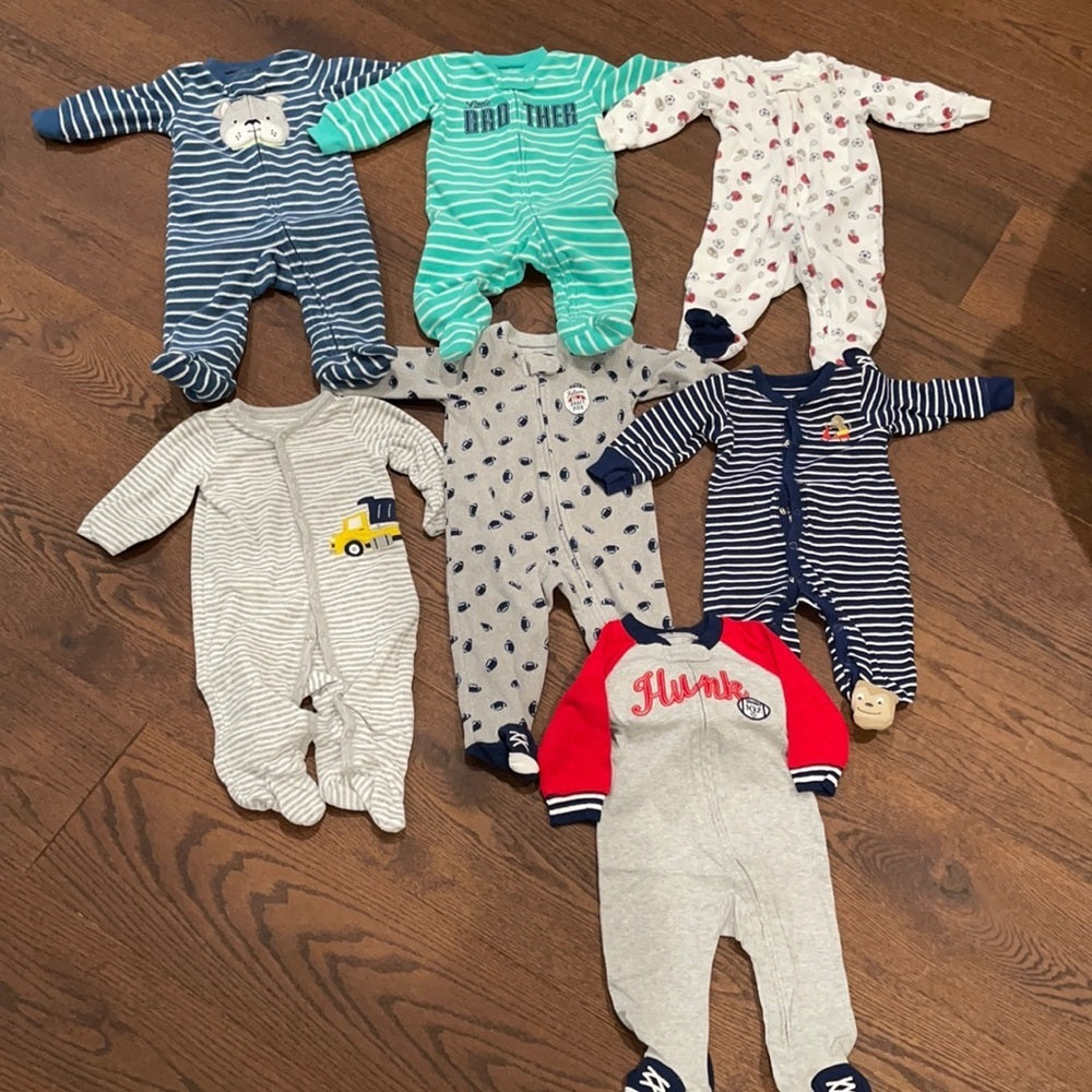 7 Pairs of Carter’s 6 months Footed Pajamas