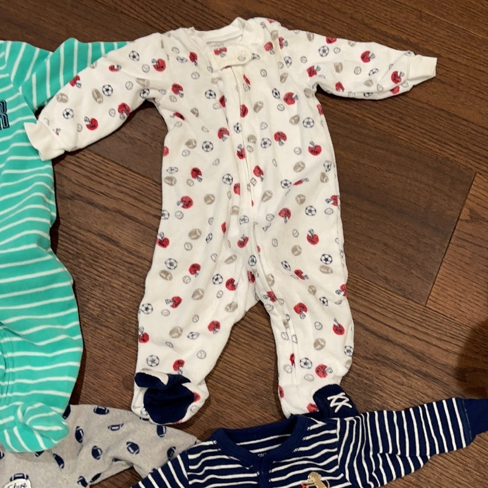 7 Pairs of Carter’s 6 months Footed Pajamas
