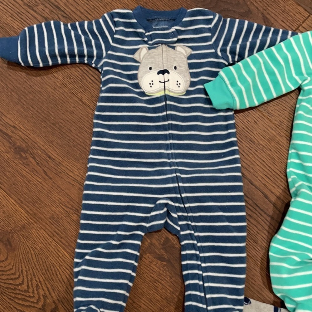 7 Pairs of Carter’s 6 months Footed Pajamas