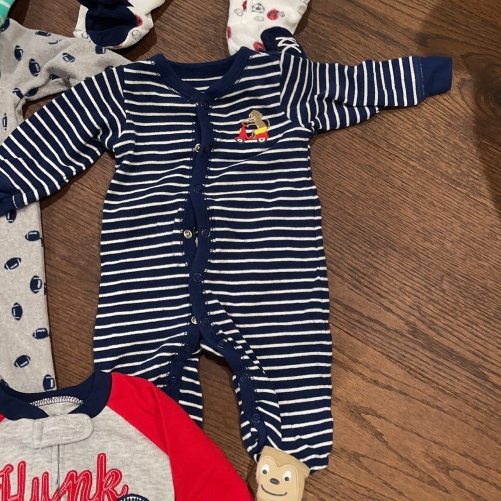 7 Pairs of Carter’s 6 months Footed Pajamas