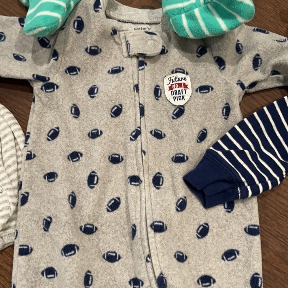 7 Pairs of Carter’s 6 months Footed Pajamas