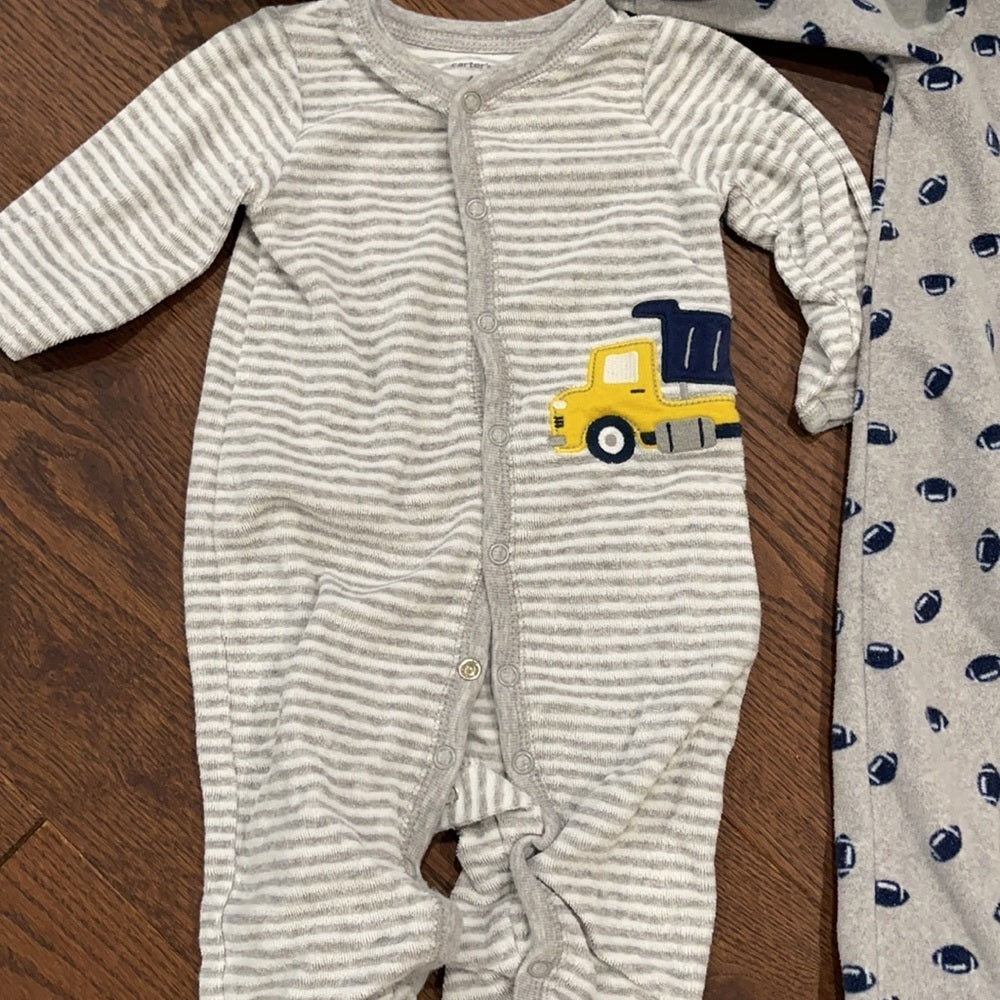 7 Pairs of Carter’s 6 months Footed Pajamas