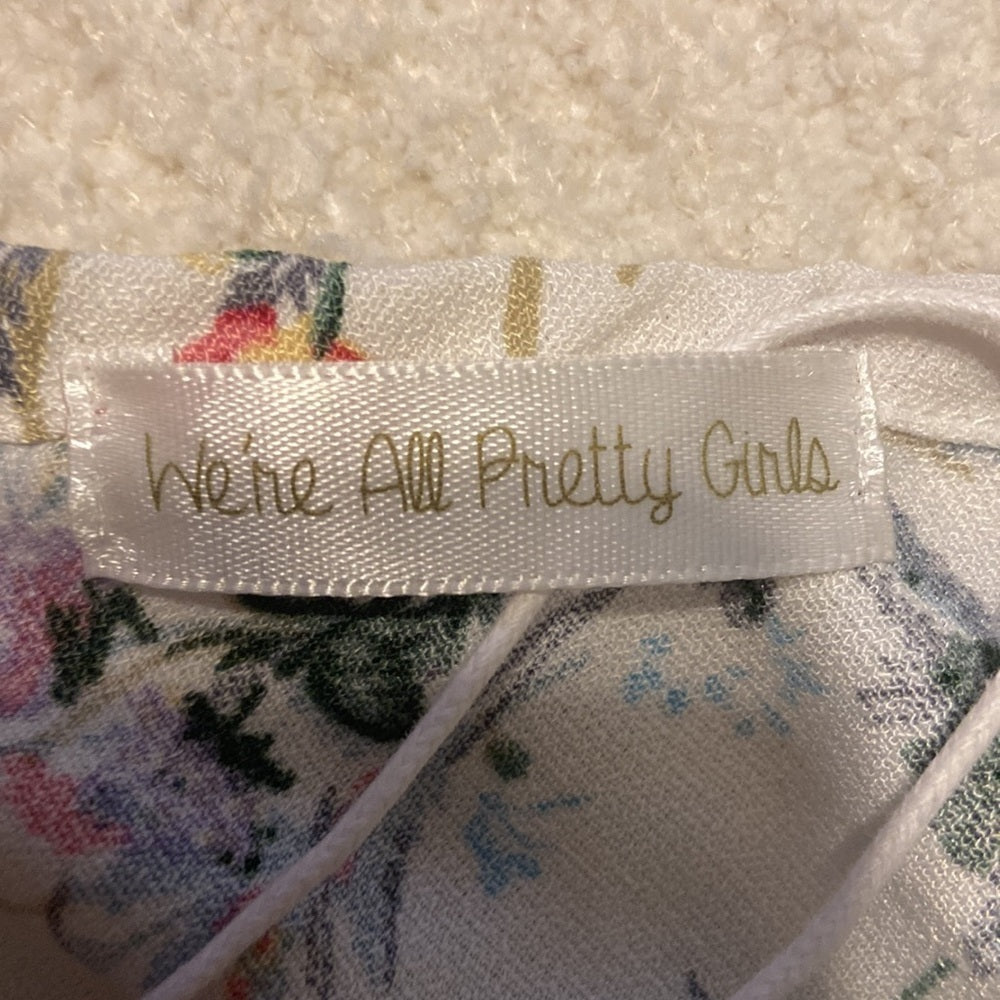 WOMEN’S We’re All Pretty Girls top. White with floral. Size M
