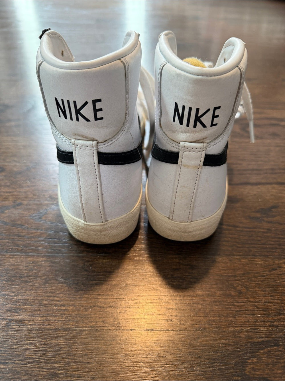 Nike Women’s White High-Top Sneakers with Black Swoosh Size 7