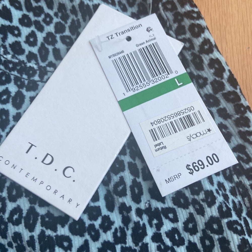NWT WOMEN’S TDC skirt. Leopard print. Size L